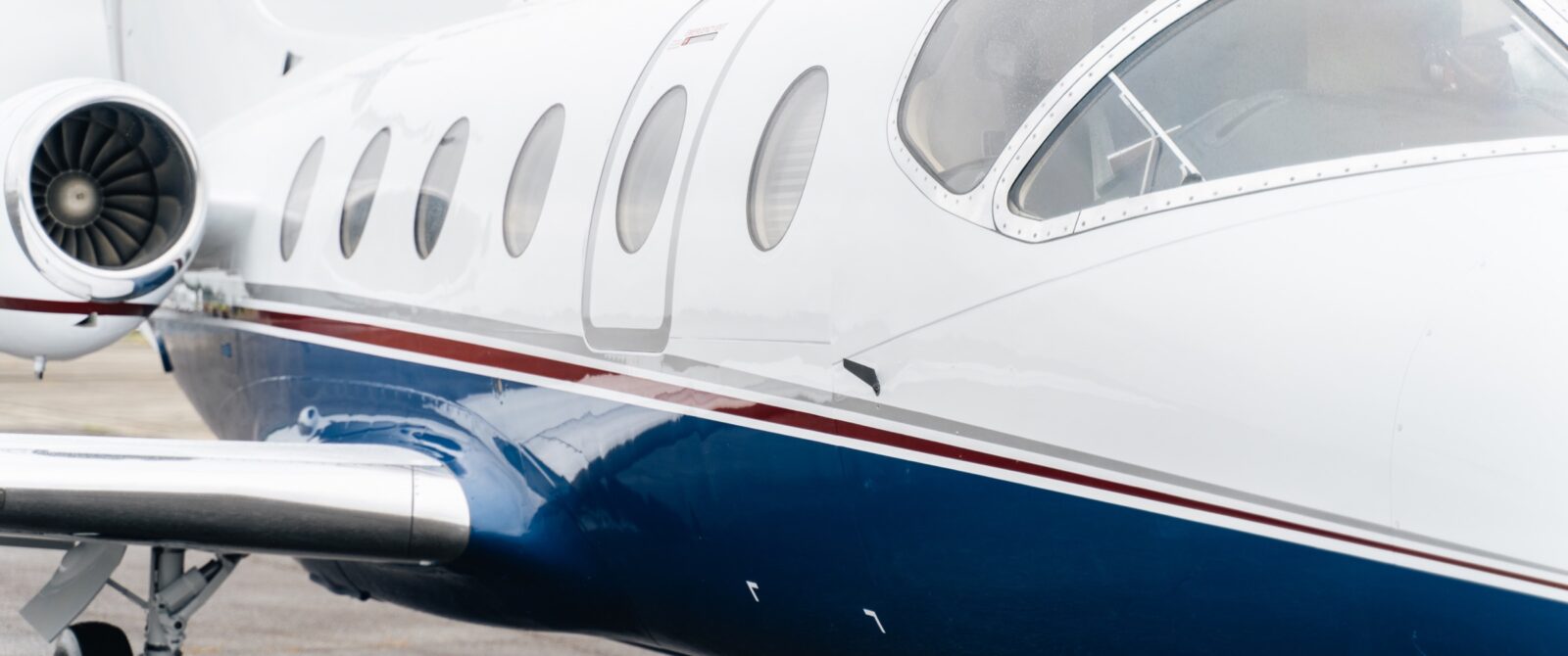 Close-up view of a private jet on a runway